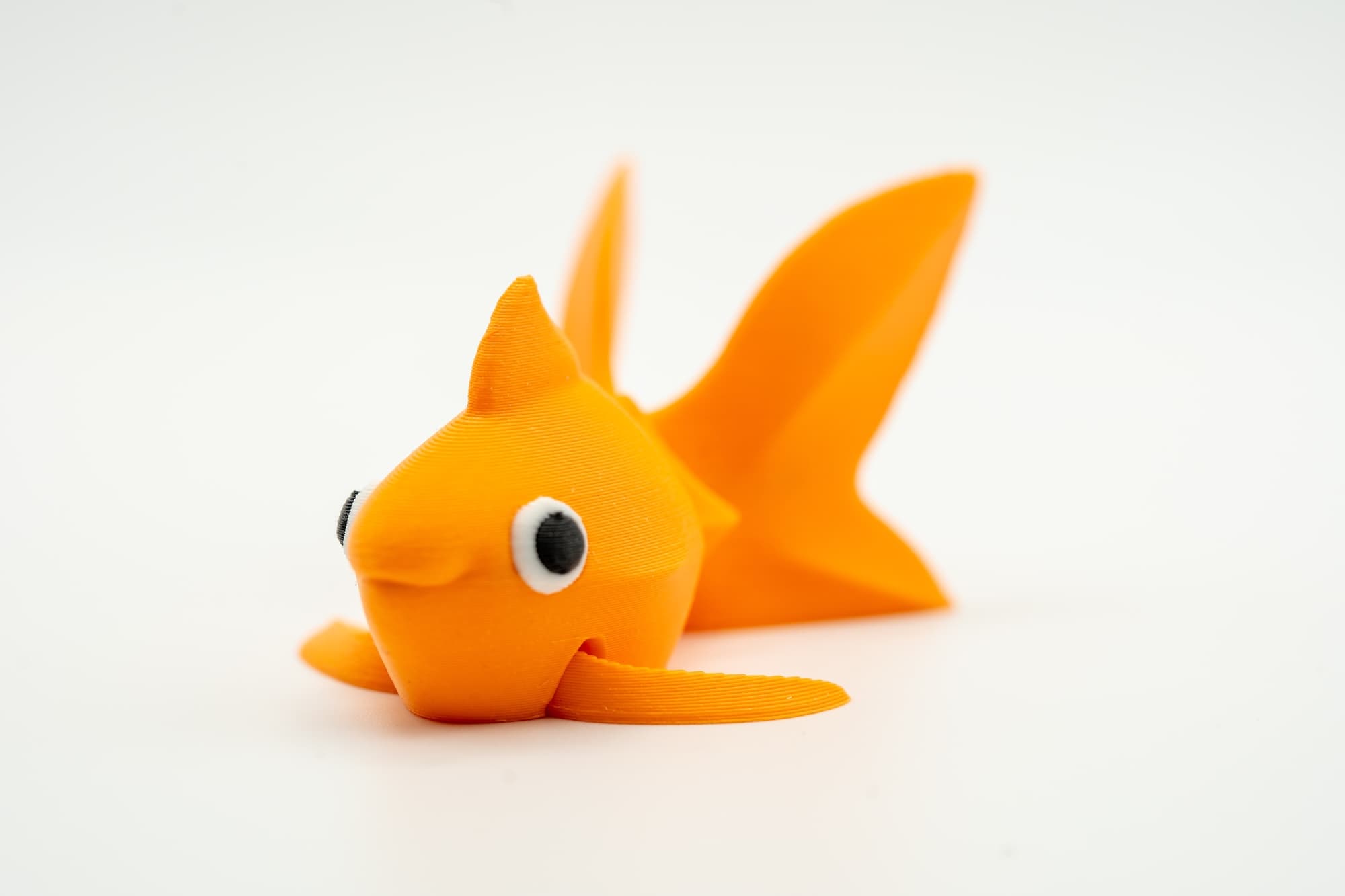 Spoolio Poisson rouge articule face 1